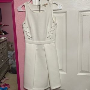 White fitted dress at top cleavage area